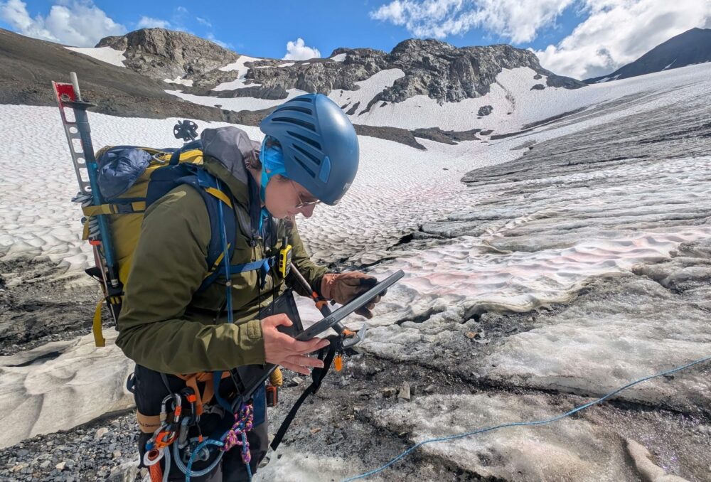 DUC geospatial and remote sensing expert Rebecca Edwards marks GPS points for glacial features, creating an updated map of the terrain. This information will support understanding the health and extent of the current glacier.