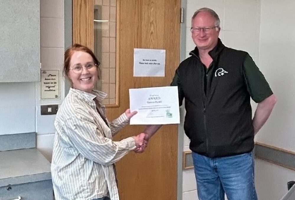 Brooke Howat (nominator) presents Trevor Plews with the Forage Industry Innovation Award at the Saskatchewan Forage Council’s AGM on June 24, 2026.