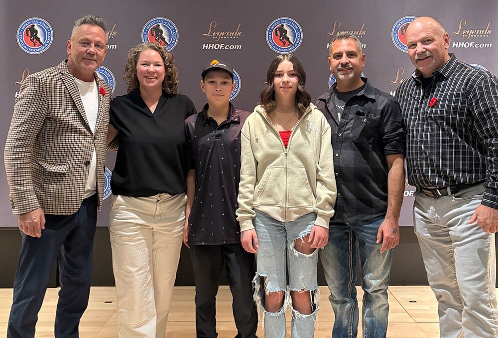 Yvonne Kuchta (second from left) and her family, Year 1 grand prize winners of DUC’s Small Ponds, Big Goals contest, are pictured alongside Canadian hockey legends Doug Gilmour (left) and Wendel Clark (right) at the Hockey Hall of Fame in November 2025.